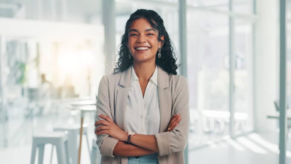 Confident business woman in modern office representing UK right to work checks and employment compliance