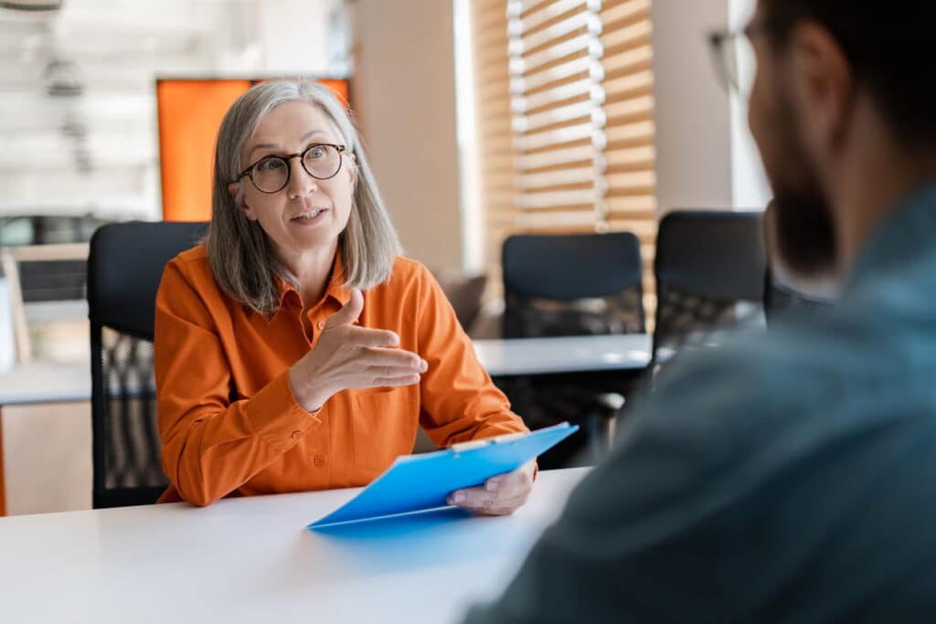 two people discussing the difference between ad-hoc HR support and a HR retainer