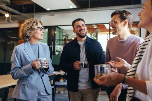Manager having an informal conversation with employees to resolve workplace concerns before they escalate into grievances