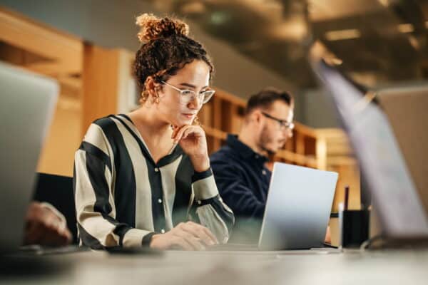 HR professional reviewing new probation and unfair dismissal policies under the Employment Rights Act 2025 on a laptop